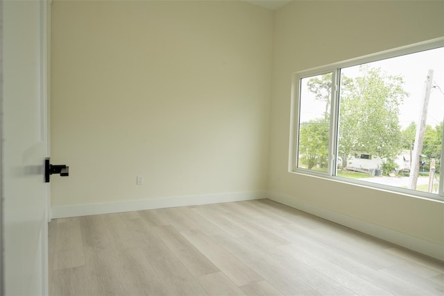 12484 Cross St, Largo, FL 33773 - unfurnished room featuring light wood-type flooring and baseboards