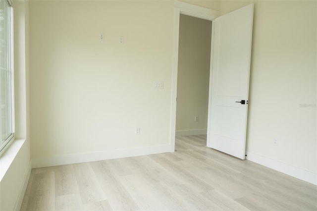 12484 Cross St, Largo, FL 33773 - spare room featuring light wood-style flooring and baseboards