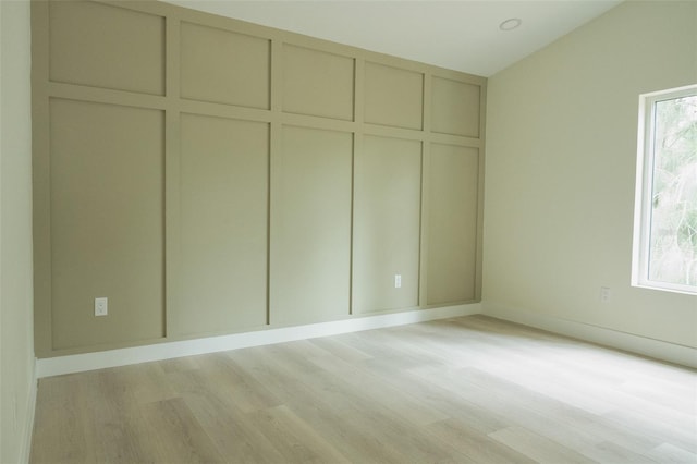 12484 Cross St, Largo, FL 33773 - unfurnished bedroom with light wood-style floors, baseboards, and a closet