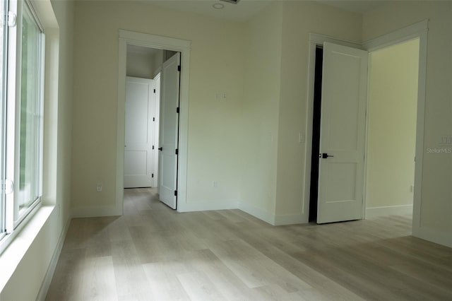 12484 Cross St, Largo, FL 33773 - unfurnished room with light wood-style flooring and baseboards