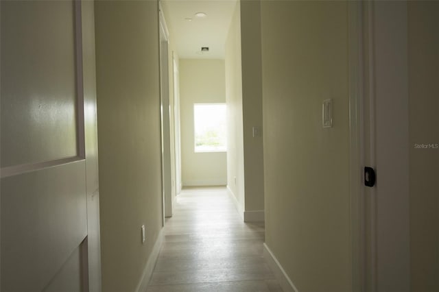 12484 Cross St, Largo, FL 33773 - hall featuring baseboards and light wood-style flooring
