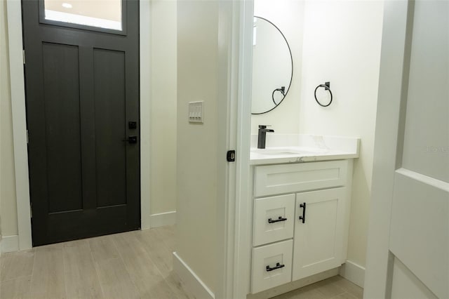 12484 Cross St, Largo, FL 33773 - bathroom featuring vanity and wood finished floors
