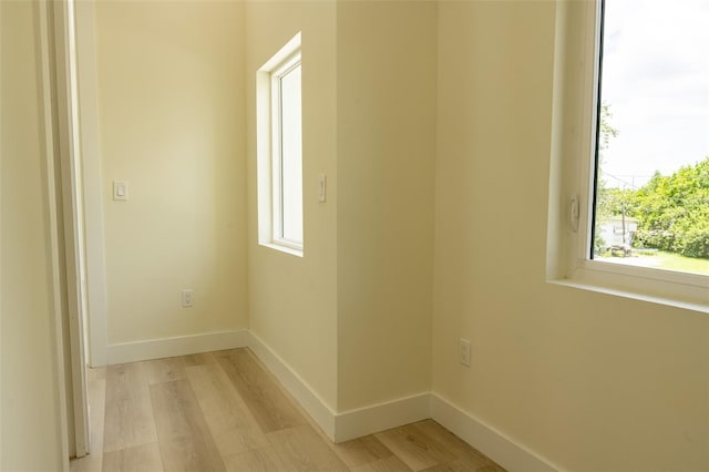 12484 Cross St, Largo, FL 33773 - spare room with light wood-style floors and healthy amount of natural light