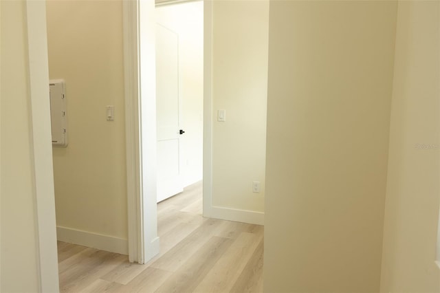 12484 Cross St, Largo, FL 33773 - corridor with light wood-style flooring and baseboards