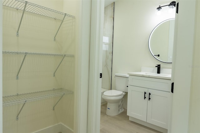 12484 Cross St, Largo, FL 33773 - full bath featuring vanity, wood finished floors, and a spacious closet