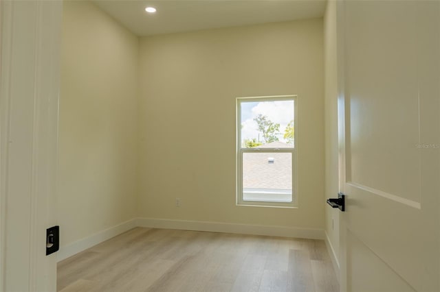 12484 Cross St, Largo, FL 33773 - empty room with light wood finished floors and recessed lighting