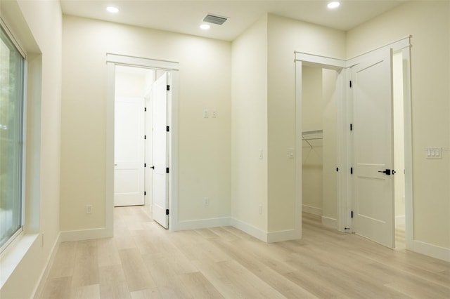 12484 Cross St, Largo, FL 33773 - corridor with light wood-type flooring and recessed lighting