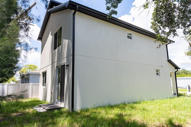 12484 Cross St, Largo, FL 33773 - view of side of property with stucco siding