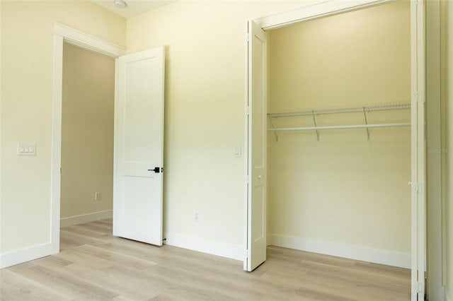 12484 Cross St, Largo, FL 33773 - unfurnished bedroom featuring a closet and light wood-type flooring