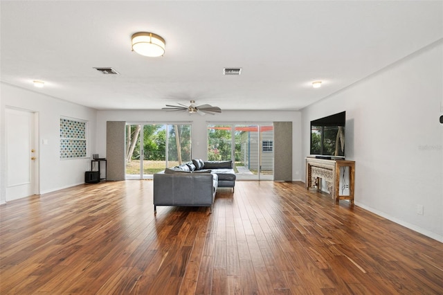 5826 20th Ave S, Gulfport, FL 33707 - living room with baseboards, a ceiling fan, hardwood / wood-style flooring, and visible vents