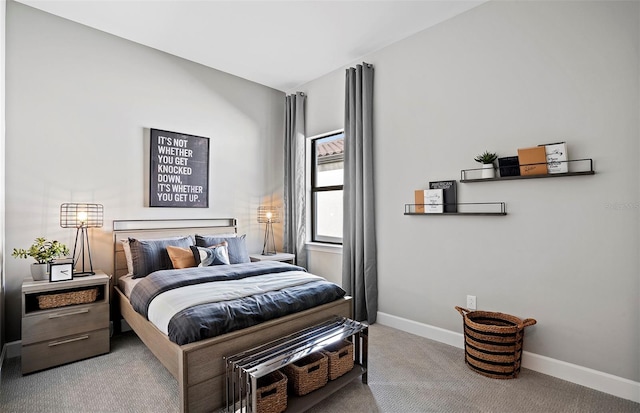 carpeted bedroom featuring baseboards