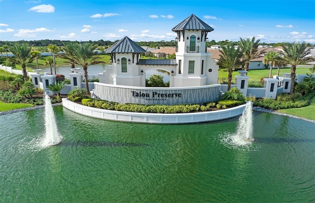 surrounding community featuring a water view