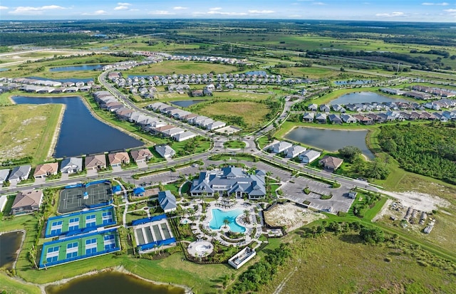 drone / aerial view with a water view and a residential view