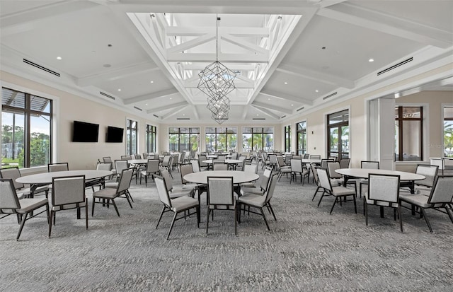 carpeted dining space with visible vents, coffered ceiling, plenty of natural light, and beam ceiling