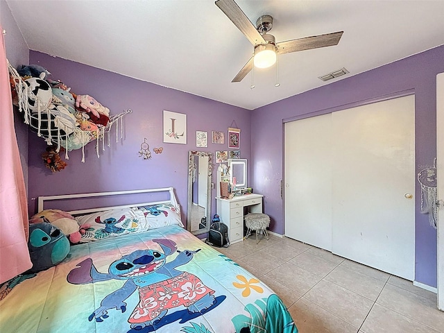 7237 Bramblewood Dr, Port Richey, FL 34668 - tiled bedroom with a closet, a ceiling fan, and visible vents
