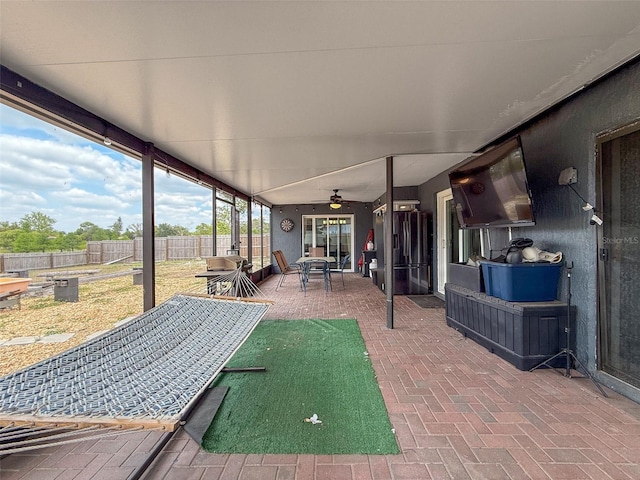 7237 Bramblewood Dr, Port Richey, FL 34668 - view of patio / terrace with fence, outdoor dining area, and ceiling fan