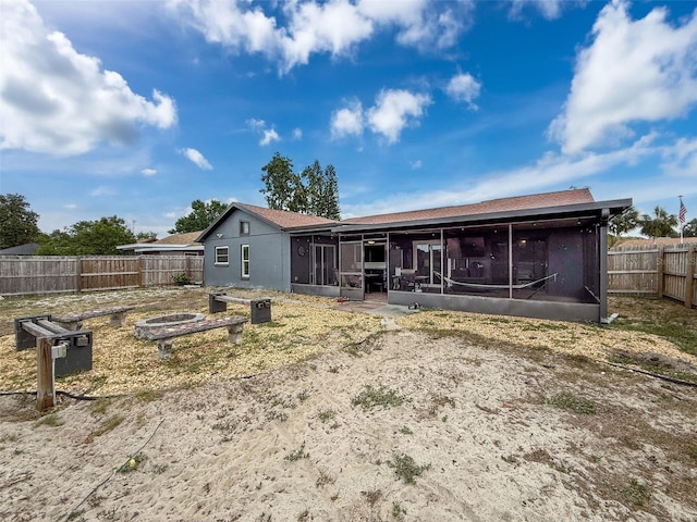 7237 Bramblewood Dr, Port Richey, FL 34668 - back of house with a fenced backyard and a sunroom