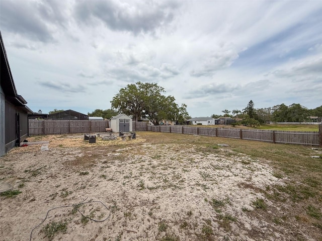 7237 Bramblewood Dr, Port Richey, FL 34668 - view of yard featuring a storage shed, an outdoor structure, and a fenced backyard