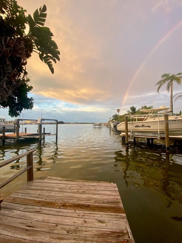14555 N Bayshore Dr, Madeira Beach, FL 33708 - view of dock with boat lift and a water view