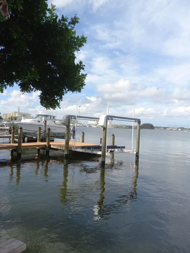 14555 N Bayshore Dr, Madeira Beach, FL 33708 - view of dock with boat lift and a water view
