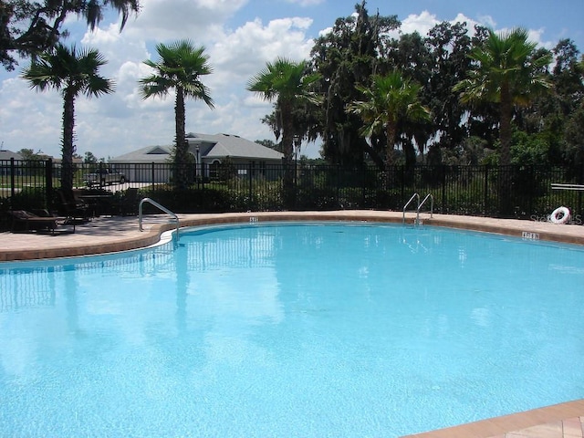 community pool featuring fence