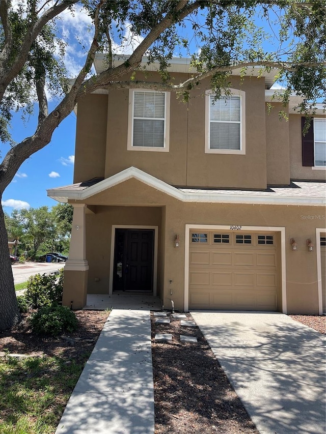 10402 Tulip Field Way, Riverview, FL 33578 - townhome / multi-family property featuring stucco siding, an attached garage, and concrete driveway