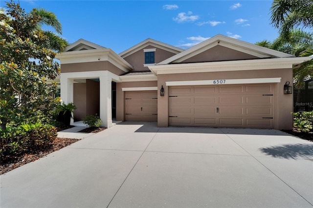 6507 Maiden Sea Dr, Apollo Beach, FL 33572 - view of front facade featuring an attached garage, stucco siding, and driveway