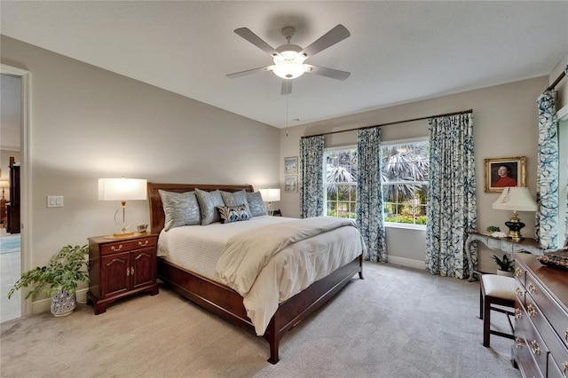 6507 Maiden Sea Dr, Apollo Beach, FL 33572 - bedroom with light colored carpet, baseboards, and ceiling fan