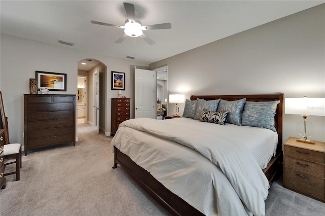 6507 Maiden Sea Dr, Apollo Beach, FL 33572 - bedroom with arched walkways, a ceiling fan, light colored carpet, and visible vents