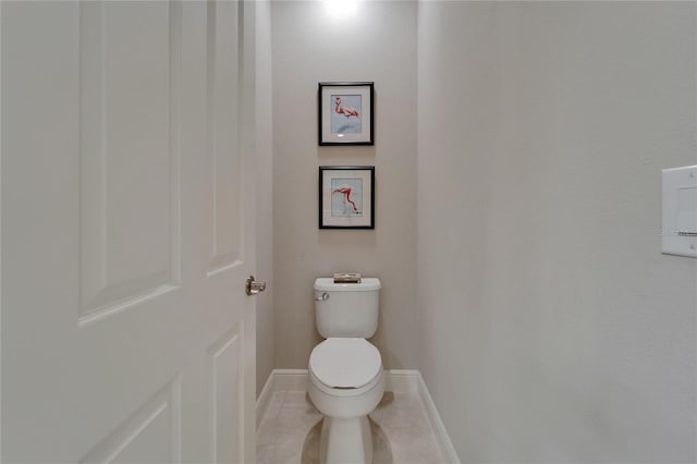 6507 Maiden Sea Dr, Apollo Beach, FL 33572 - bathroom with baseboards, tile patterned floors, and toilet