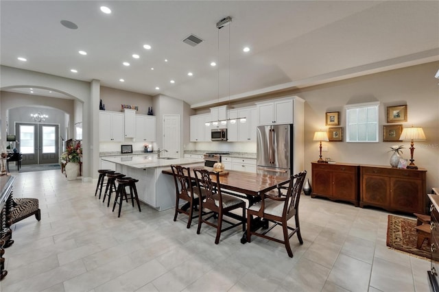 6507 Maiden Sea Dr, Apollo Beach, FL 33572 - dining room featuring visible vents, arched walkways, recessed lighting, and french doors