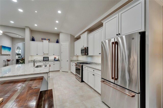 6507 Maiden Sea Dr, Apollo Beach, FL 33572 - kitchen featuring a sink, white cabinets, stainless steel appliances, and recessed lighting