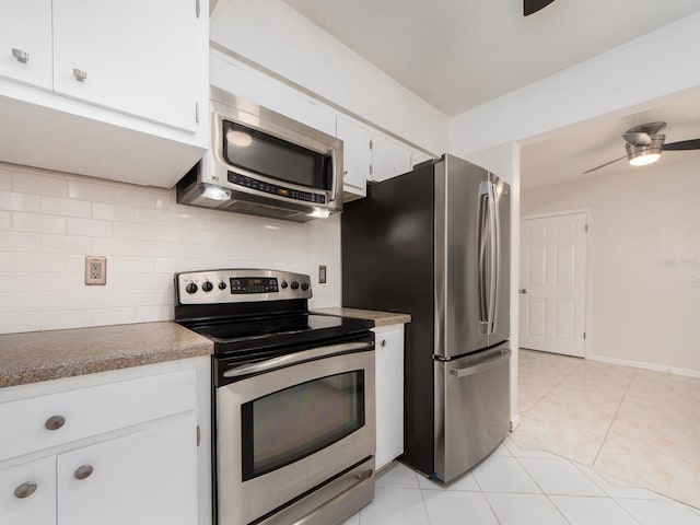 kitchen featuring white cabinets, appliances with stainless steel finishes, ceiling fan, and tasteful backsplash