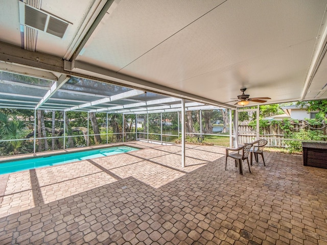 outdoor pool with a patio area and fence