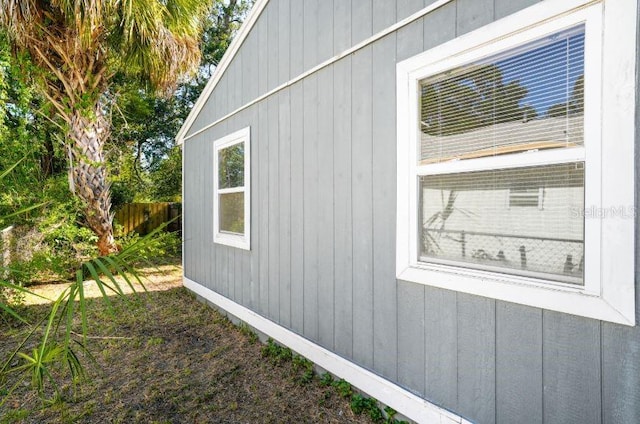 view of home's exterior with fence