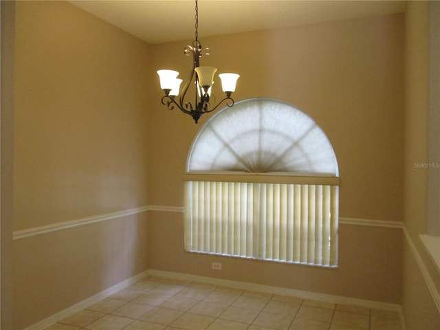 2213 Towering Oaks Cir, Seffner, FL 33584 - spare room with a chandelier and tile patterned flooring