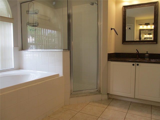 2213 Towering Oaks Cir, Seffner, FL 33584 - bathroom featuring a stall shower, vanity, tile patterned flooring, and a bath