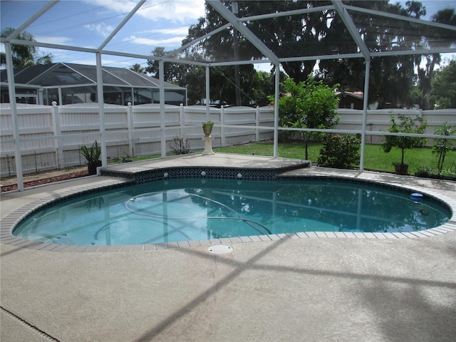 2213 Towering Oaks Cir, Seffner, FL 33584 - view of pool with a fenced backyard, glass enclosure, and a patio