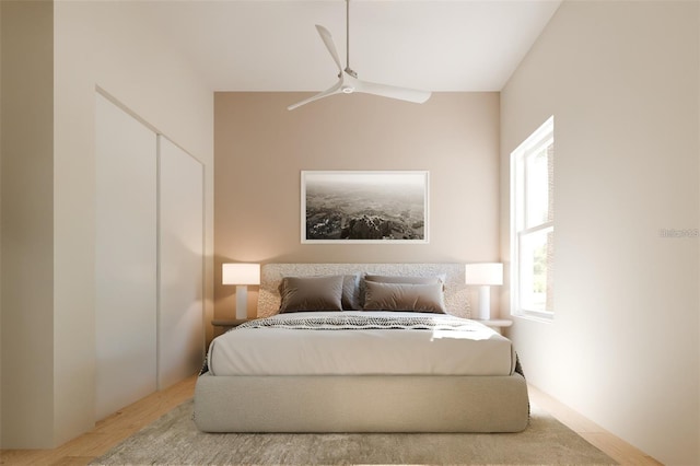 bedroom with a ceiling fan and multiple windows