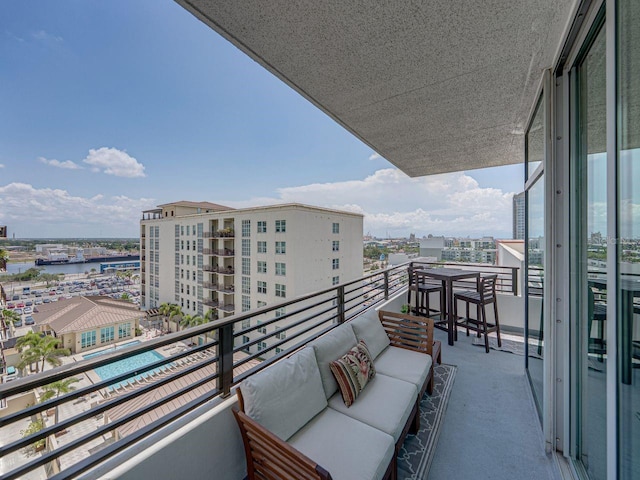 balcony with a city view and an outdoor living space