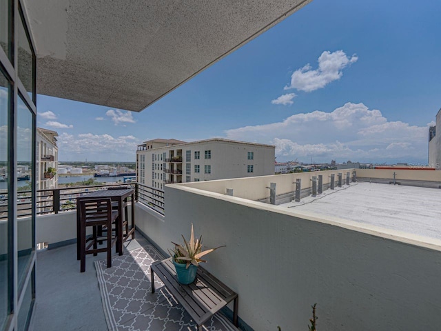 balcony featuring a water view
