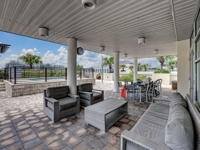 view of patio / terrace featuring outdoor lounge area, outdoor dining space, and fence