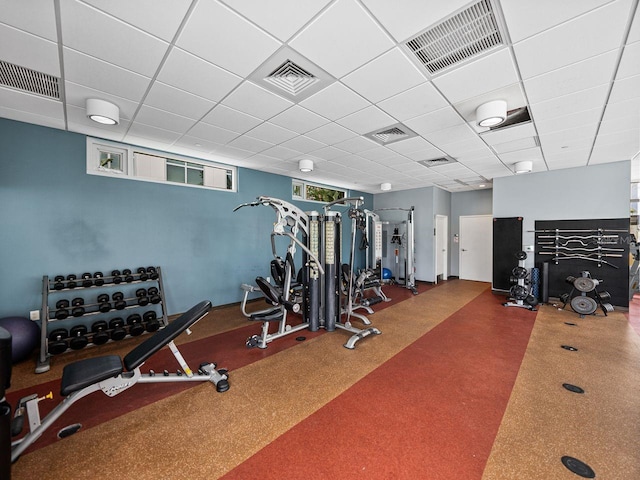 workout area with a paneled ceiling