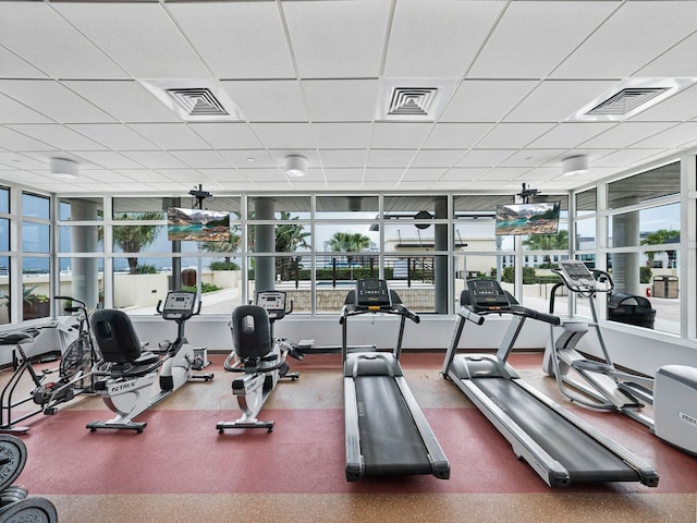 gym featuring a paneled ceiling