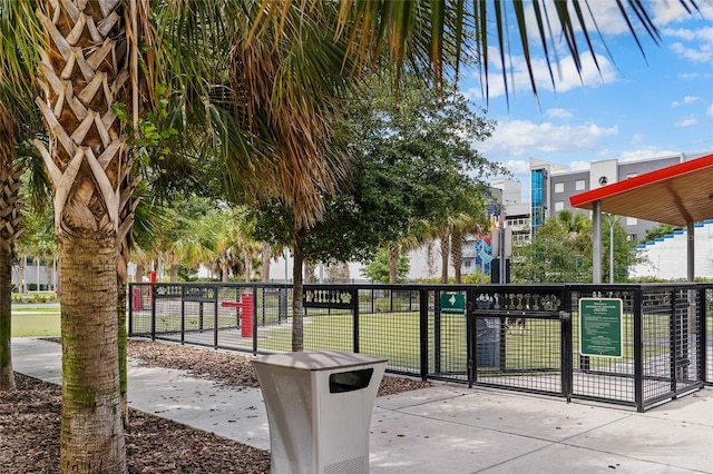 view of property's community with a dog friendly area and fence