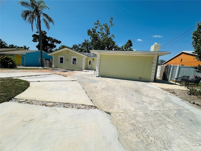 1101 Alcazar Way S, Saint Petersburg, FL 33705 - single story home featuring fence and a chimney