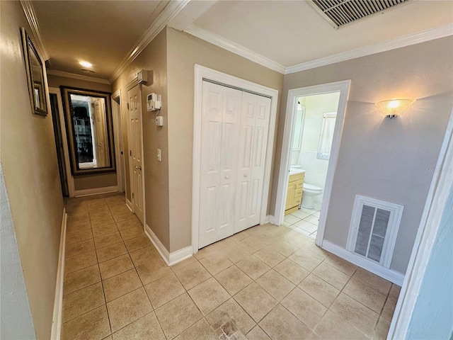 1101 Alcazar Way S, Saint Petersburg, FL 33705 - hall featuring crown molding, baseboards, visible vents, and light tile patterned floors