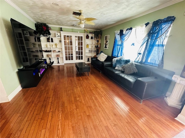 1101 Alcazar Way S, Saint Petersburg, FL 33705 - living area featuring crown molding, ceiling fan, french doors, and hardwood / wood-style flooring