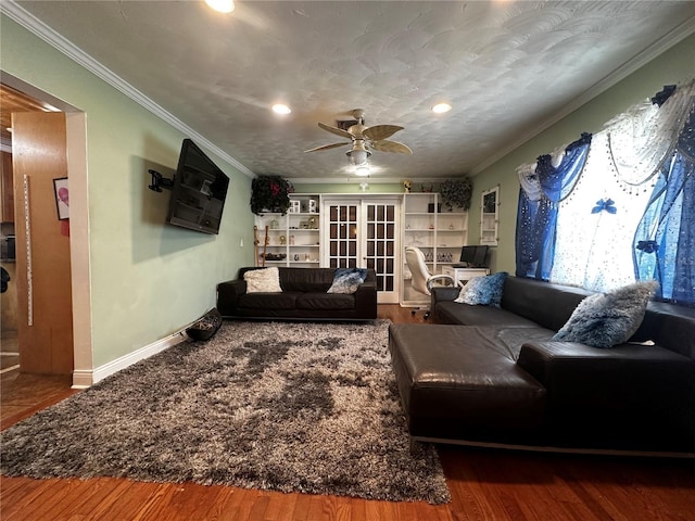 1101 Alcazar Way S, Saint Petersburg, FL 33705 - living room with crown molding, a ceiling fan, and wood finished floors