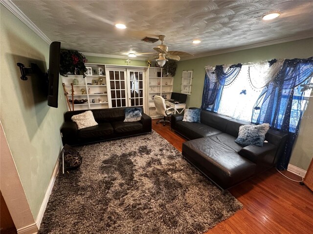1101 Alcazar Way S, Saint Petersburg, FL 33705 - living area with a ceiling fan, visible vents, wood finished floors, baseboards, and ornamental molding